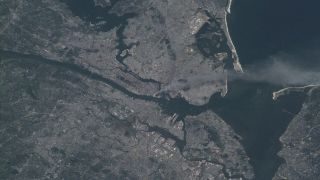 The aftermath of the 9/11 attacks on the World Trace Center in New York City, as seen by the astronauts onboard the International Space Station on Sept. 11, 2001.