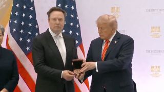 President Donald Trump gives SpaceX founder and CEO Elon Musk the National Medal of Science during a ceremony at the White House on Oct. 8, 2026.