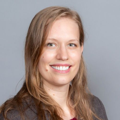 Image of Lydia Griffiths in a composed and formal setting.